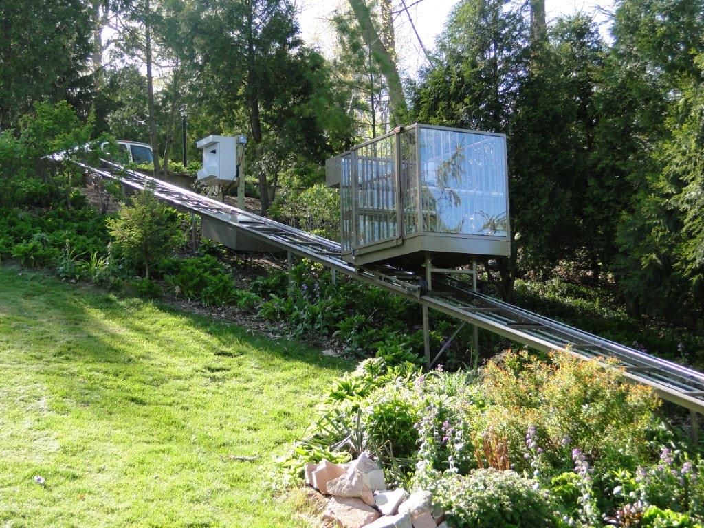 Inclined elevator running down a steep hillside to the waterfront