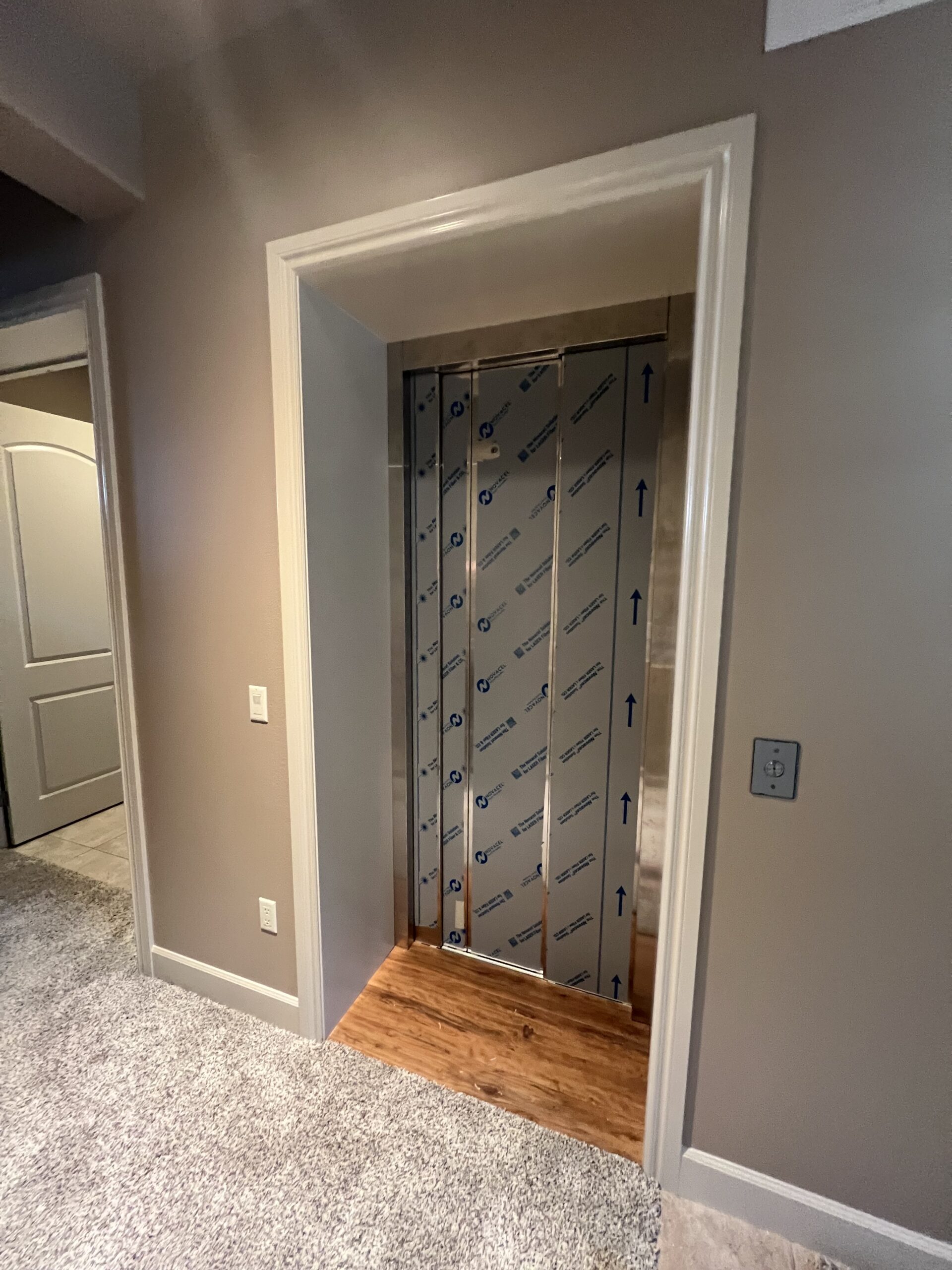 Custom residential home elevator with finished landing in a Spokane home